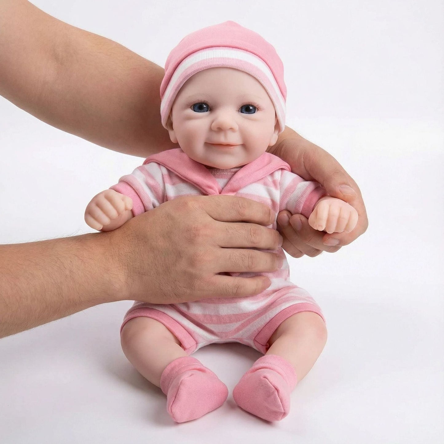 Bébé reborn Felicia de 30 cm en silicone intégral fille vêtue de vêtements à rayures roses