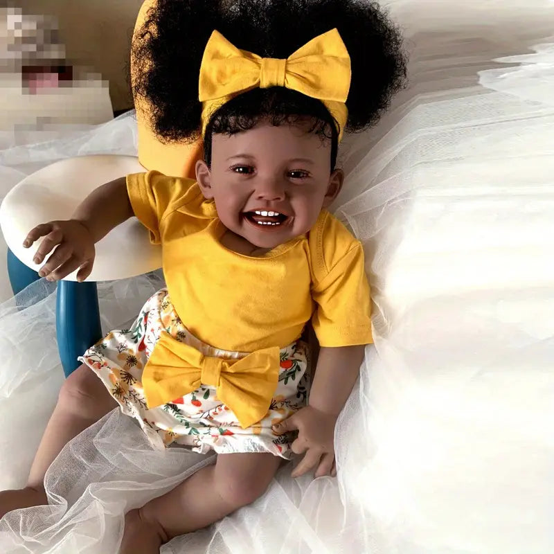 Poupée Reborn afro-américaine Mila de 60 cm aux cheveux bouclés et souriants