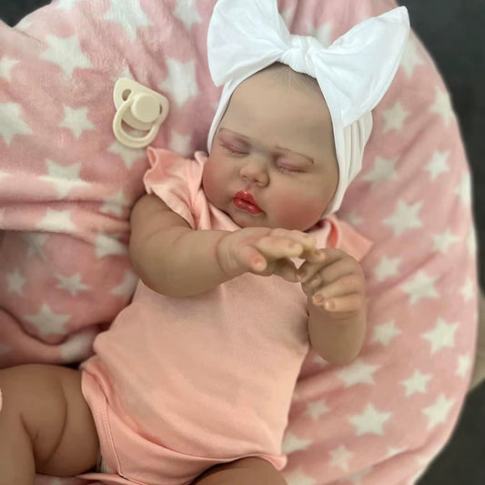 Poupée Reborn Pickle de 60 cm yeux fermés vêtements roses