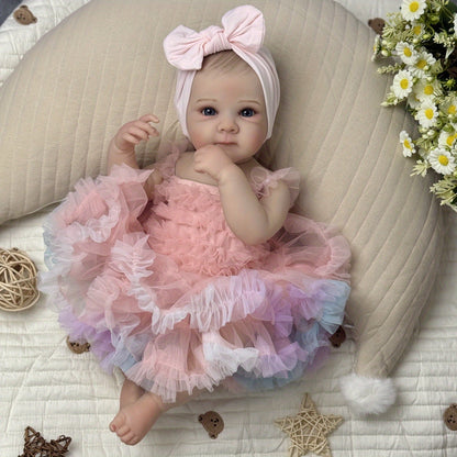 Bébé reborn Bettie 48 cm yeux ouverts en robe rose