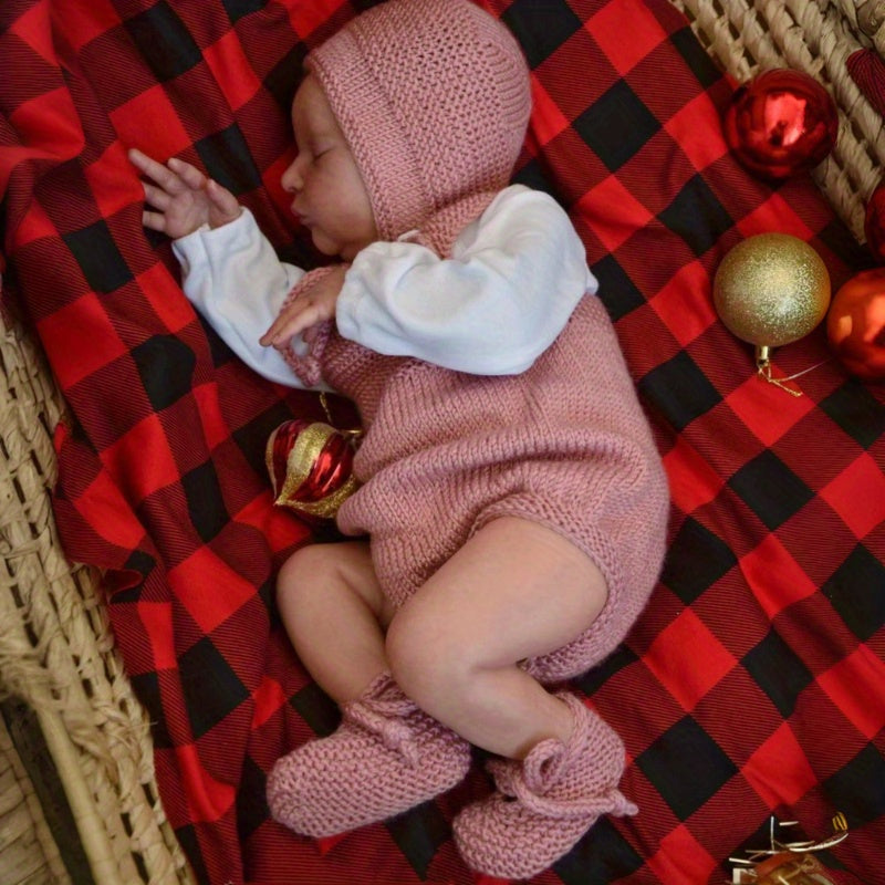 Poupée reborn Laura endormie corps souple de 50 cm vêtue d'un pull rose