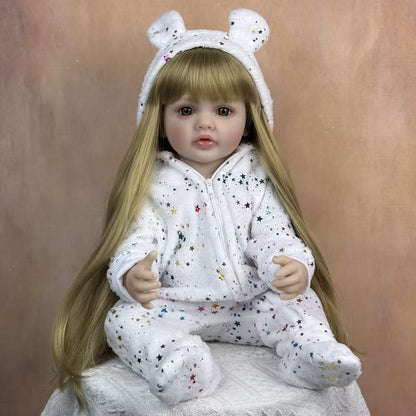 Bébé reborn Betty 55 cm yeux ouverts longs cheveux blonds en combinaison à étoiles