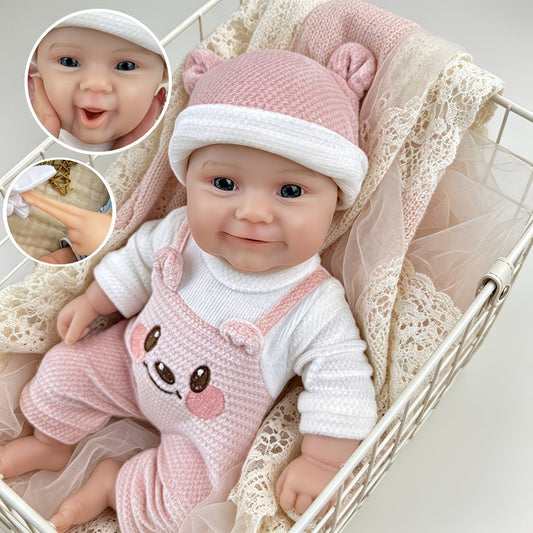Bébé reborn Maddie Smile de 30 cm en silicone intégral vêtue d'une tenue d'ours rose