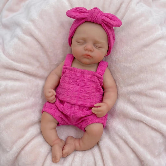 Poupée reborn Irys de 30 cm réaliste entièrement en silicone yeux fermés vêtue de tenues roses