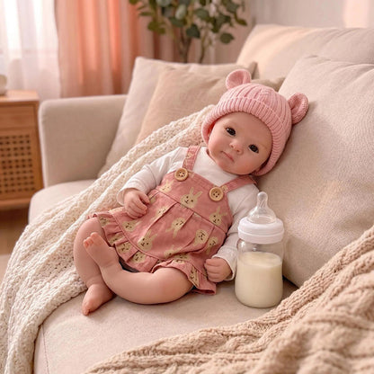 Bébé reborn Bettie en silicone de 30 cm fille vêtue d'une robe rose
