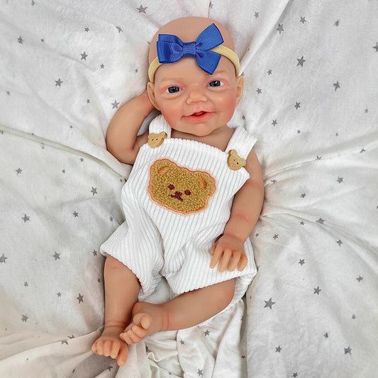 Poupée reborn Charlie 30cm sourire réaliste yeux bleus entièrement en silicone