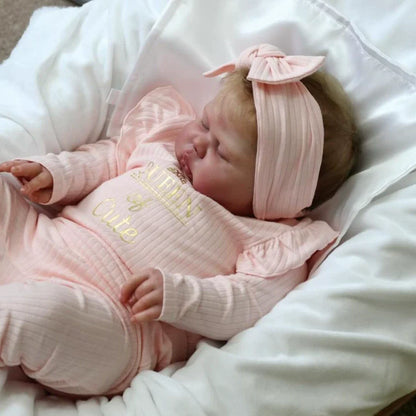 Poupée Reborn Pickle de 60 cm yeux fermés vêtements roses