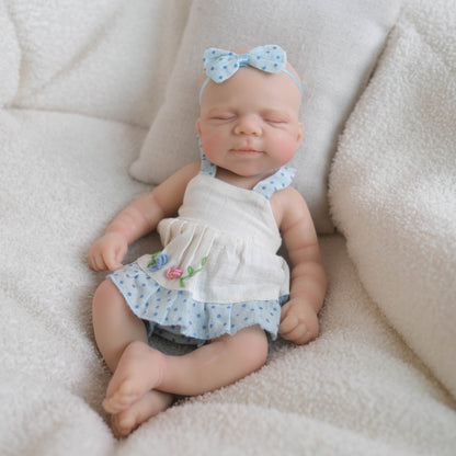 Bébé reborn Pascale en silicone de 20 cm fille vêtue d'une robe bleue