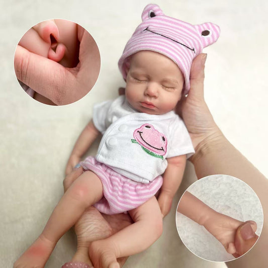 Poupée reborn Loulou de 30cm réaliste en silicone souple endormie vêtue de vêtements roses à motif de grenouille
