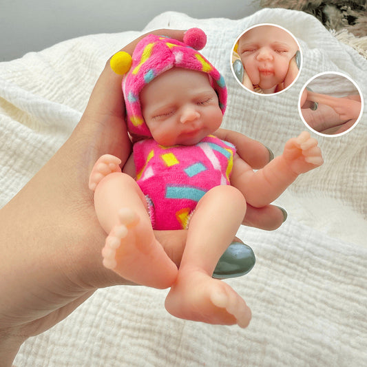 Poupée reborn miniature Pascale de 15 cm yeux fermés en silicone vêtue de tenues roses