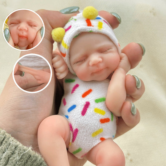 Poupée reborn miniature Pascale de 15 cm yeux fermés en silicone vêtue de tenues blanches