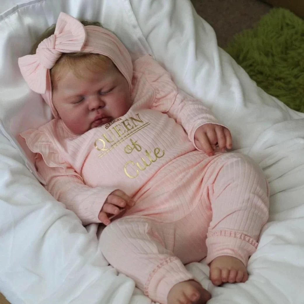 Poupée Reborn Pickle de 60 cm yeux fermés vêtements roses