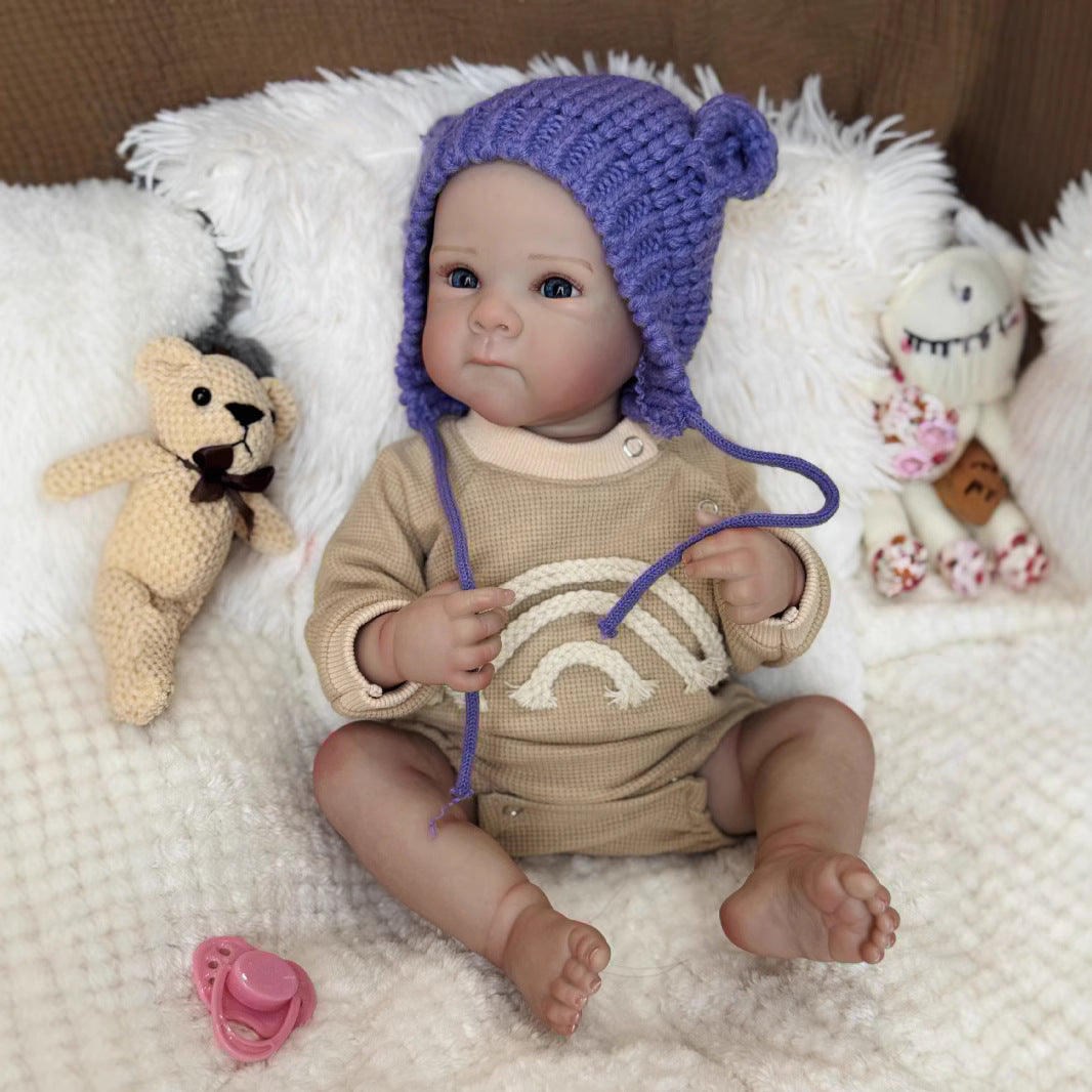 Bébé fille reborn Kelly aux yeux bleus de 50cm avec chapeau violet - Bettie