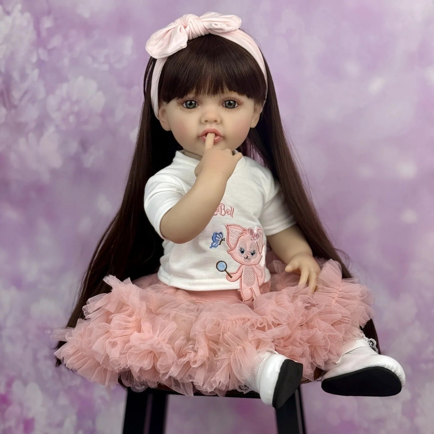 Bébé reborn Betty 55 cm cheveux longs robe rose