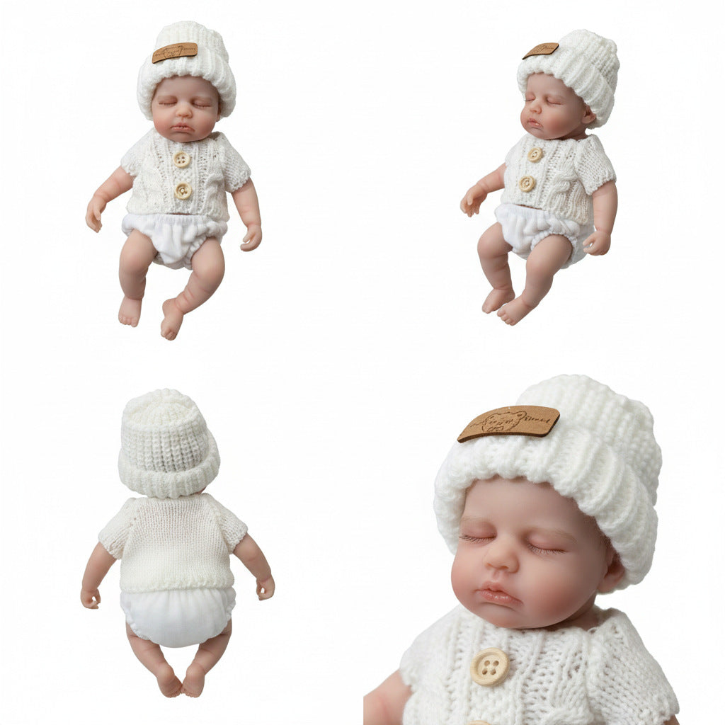 Bébé reborn Loulou fille de 20 cm en silicone intégral vêtue d'un pull blanc