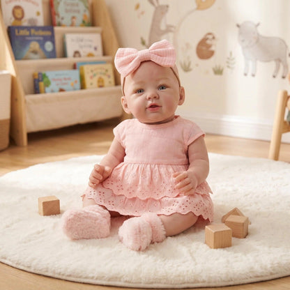 Bébé reborn Abigail de 48 cm (19 pouces) en robe rose