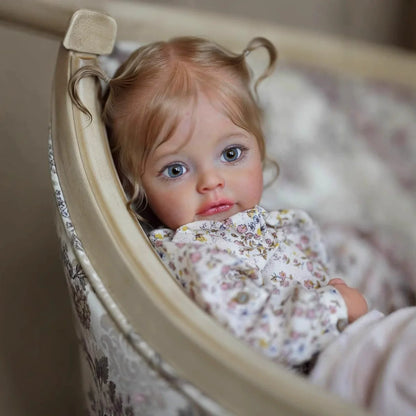 Poupée Reborn Suesue de 60 cm yeux bleus cheveux blonds vêtements à fleurs