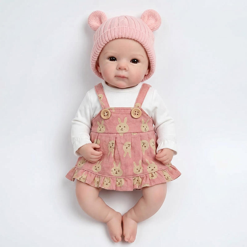 Bébé reborn Bettie en silicone de 30 cm fille vêtue d'une robe rose