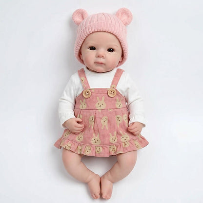 Bébé reborn Bettie en silicone de 30 cm fille vêtue d'une robe rose