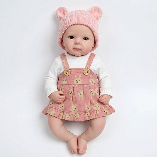 Bébé reborn Bettie en silicone de 30 cm fille vêtue d'une robe rose