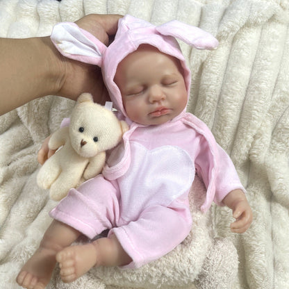 Poupée reborn Loulou de 30 cm entièrement en silicone endormie et vêtue de vêtements roses