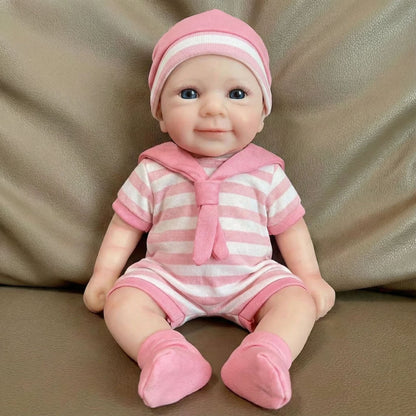 Bébé reborn Felicia de 30 cm en silicone intégral fille vêtue de vêtements à rayures roses