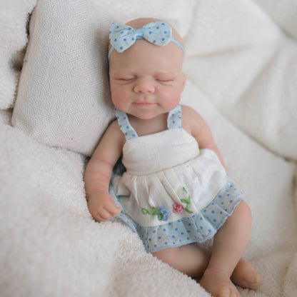 Bébé reborn Pascale en silicone de 20 cm fille vêtue d'une robe bleue
