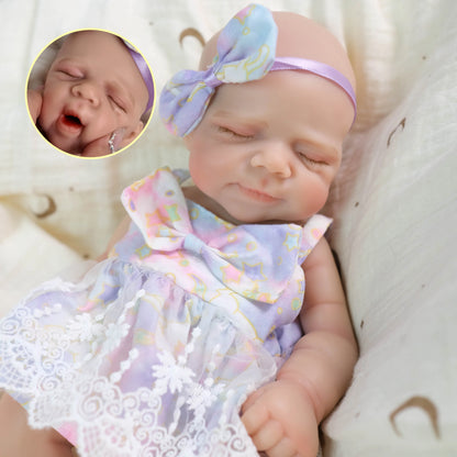 Poupée reborn Pascale de 30 cm en silicone souple bouche ouvrante vêtue d'une robe à fleurs