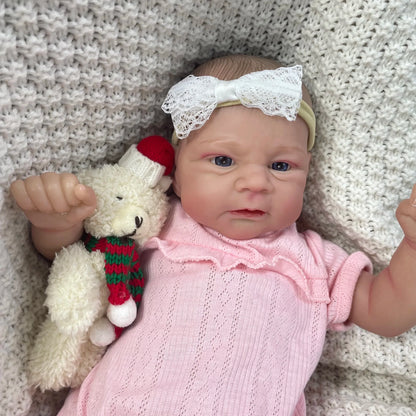 Bébé fille reborn de 48 cm aux yeux bleus et vêtements roses – Elijah