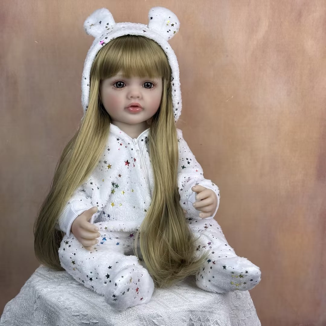 Bébé reborn Betty 55 cm yeux ouverts longs cheveux blonds en combinaison à étoiles