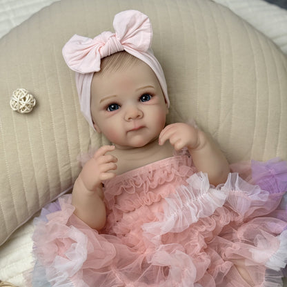 Bébé reborn Bettie 48 cm yeux ouverts en robe rose
