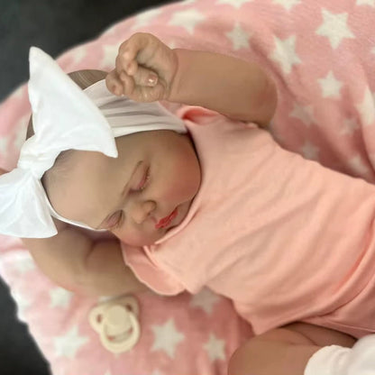 Poupée Reborn Pickle de 60 cm yeux fermés vêtements roses