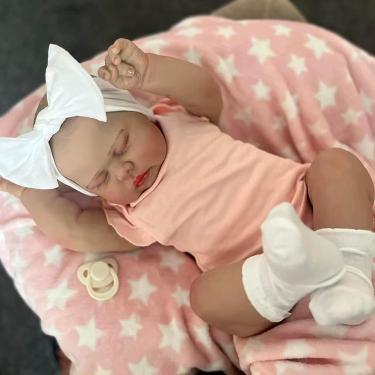 Poupée Reborn Pickle de 60 cm yeux fermés vêtements roses