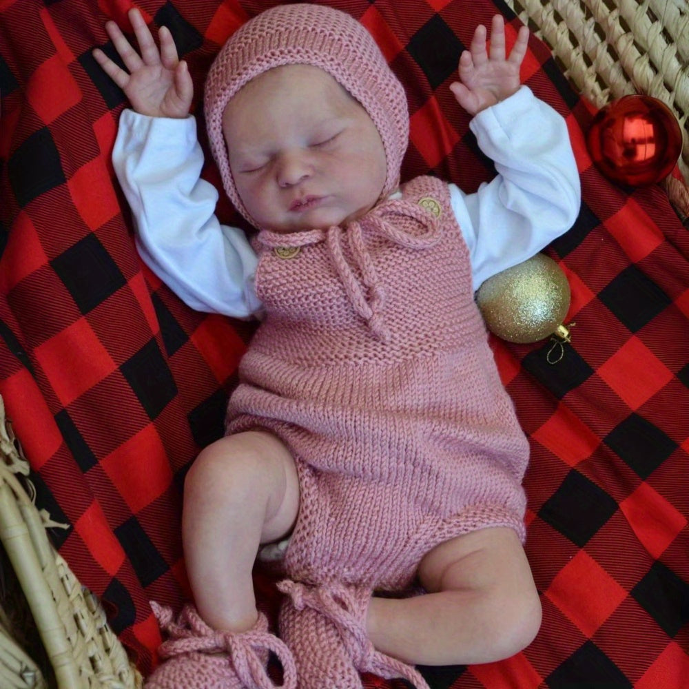 Poupée reborn Laura endormie corps souple de 50 cm vêtue d'un pull rose