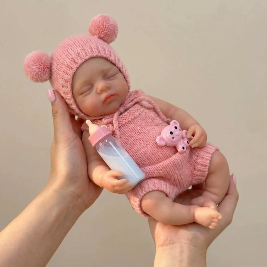 Poupée reborn Irys de 30cm en silicone intégral fille vêtue de tenues roses