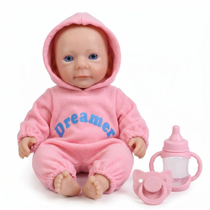Bébé reborn Felicia de 30cm en silicone intégral fille vêtue de tenues roses