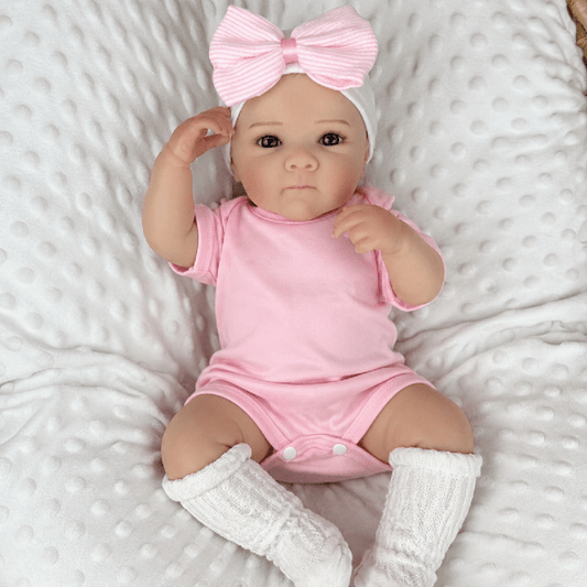 Poupée reborn Bettie 45 cm yeux bleus réalistes en body rose