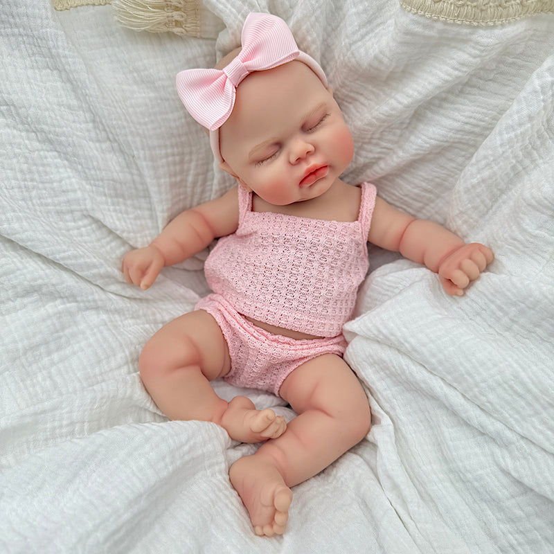 Poupée reborn Pickle de 30 cm entièrement en silicone yeux fermés en tenue rose