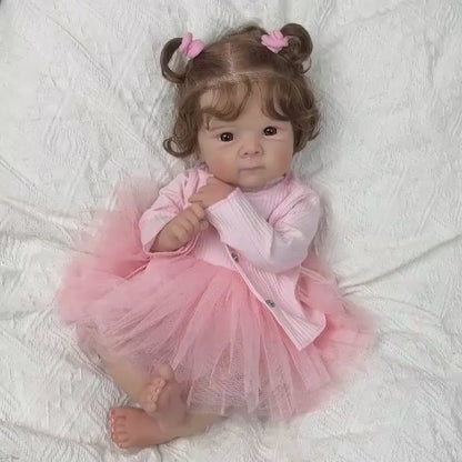 Poupée reborn Bettie de 48 cm yeux ouverts corps souple en robe rose